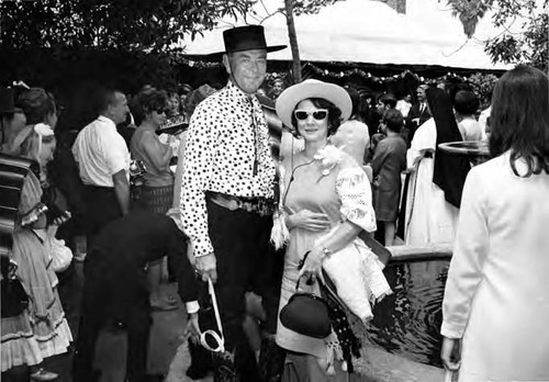 Los Amigos: John Bowles with woman in sunglasses on Olvera Street