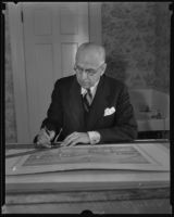 Pioneer Designer John B. Holtzclaw inspecting new drawings, Los Angeles, 1935