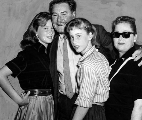 Errol Flynn with his daughters