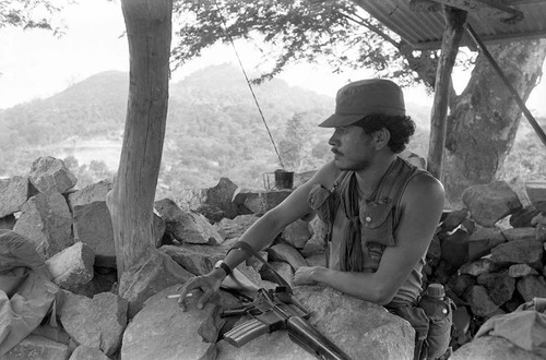 Army soldier stands at outpost, Perquín, 1983