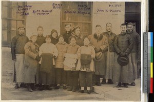 Missionaries and Chinese men and women standing in front of a brick building, Haizhou, Jiangsu, China, ca.1920