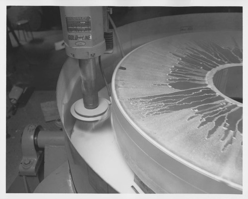 Grinding the edge of the Palomar 60-inch quartz disk at the Hale Observatories' Pasadena machine shop