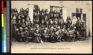Missionary sister and patients assembled before a hospital, Algeria, ca.1920-1940
