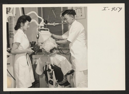 Miss Marie Watkins, the Executive Secretary of the Fresno International Institute, is getting an X-Ray of her teeth taken by