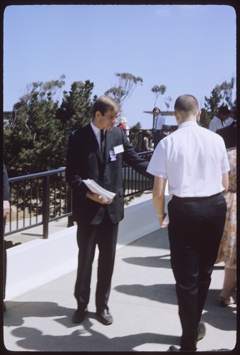 Students pass out information flyers