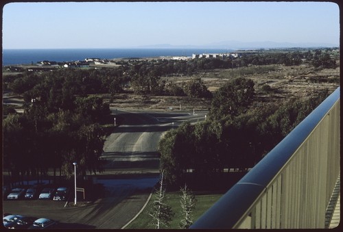 Future site of John Muir College, looking north across foundations of Camp Callan buildings with the Salk Institute for Biological Studies under construction