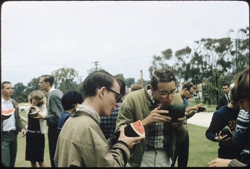 Students gather and eat watermelon at the first annual Watermelon Drop