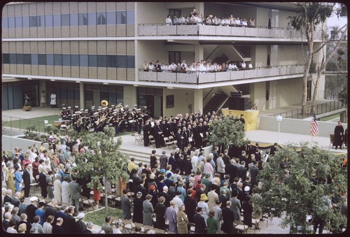 Students and faculty stand for invocation at Chancellor Galbraith's inauguration ceremony