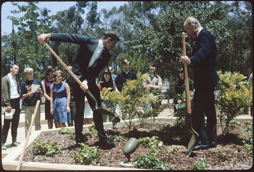 Carl Eckart and student from the class of 1968 plant a tree