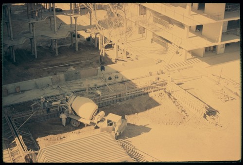 Pouring cement walls and walkways near Mayer Hall