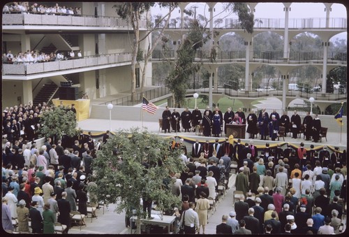 Students and faculty stand for invocation at Chancellor Galbraith's inauguration ceremony