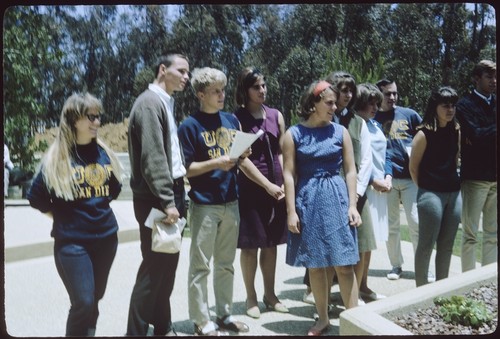 Students watch as a commemorative tree is planted by class of 1968