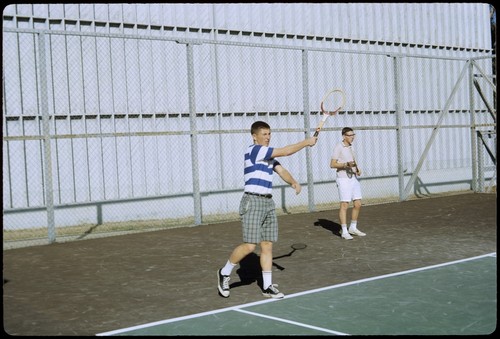 Students playing tennis on Matthews campus tennis courts