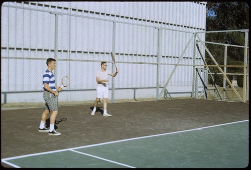 Students playing tennis on Matthews campus tennis courts