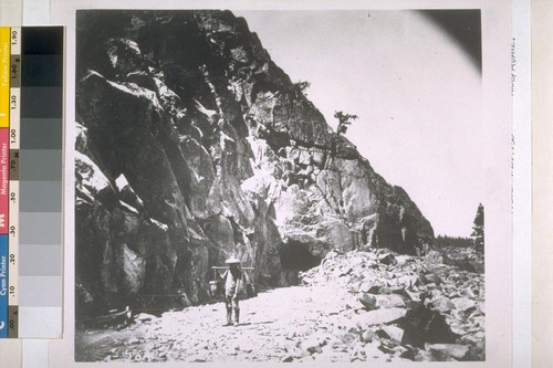 ["Heading (top cut) of East Portal, Tunnel No. 8." Unidentified Chinese man working on construction of the Central Pacific Railroad in the Sierra Nevada mountains, near Donner Lake.] [Copy photograph of Alfred. A. Hart's C.P.R.R. stereograph no. 204.]