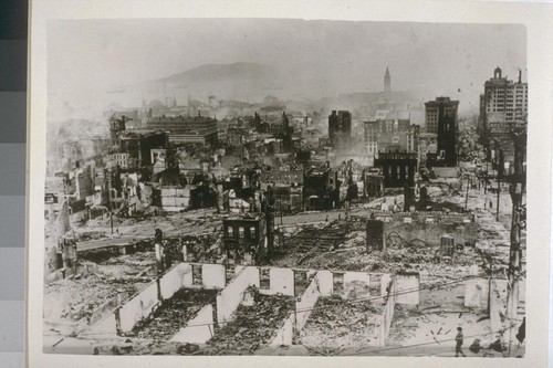 After fire. Looking down California St. Hall of Justice (tower wrecked), extreme left; U.S. Appraisers Building (never scorched), next right; Merchants' Exchange, extreme right; Old St. Mary tower, with Kohl Building (Hayward Building, at that time), behind it; Ferry Building tower, right center