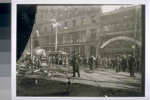 Baldwin Hotel. Parrott Building (Emporium), background; salvage pump engine for removing water from basements; Red Front Department Store (men and boys' clothing), which was one of the hottest-burning buildings in San Francisco during the earthquake and fire. 1898