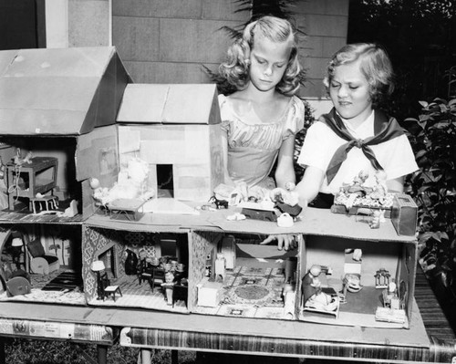 Girls finish doll house
