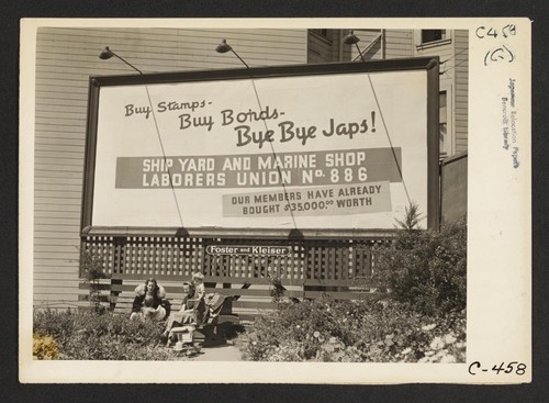 San Francisco, Calif. (Sutter and Octavia St.)--Billboard advertisement at edge of Japanese quarter, photographed on morning when 600 persons of Japanese ancestry from this section were evacuated to an assembly center. Photographer: Lange, Dorothea San Francisco, California
