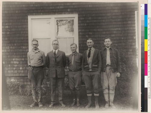 [Robert Marshall with other men outside laboratory building.]