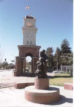 Town Clock with the sculpture, Collateral Damage