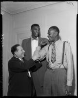 Abe Saperstein, Satch Paige, and Walter Dukes of the Harlem Globetrotters