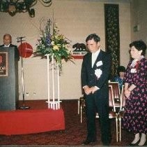 Banquet Reception: Unidentified Speaker at Podium with Woman and Man