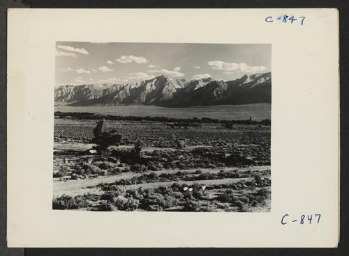 Manzanar, Calif.--A view of surrounding country flanked by beautiful mountains at this War Relocation Authority Center. Photographer: Lange, Dorothea Manzanar, California