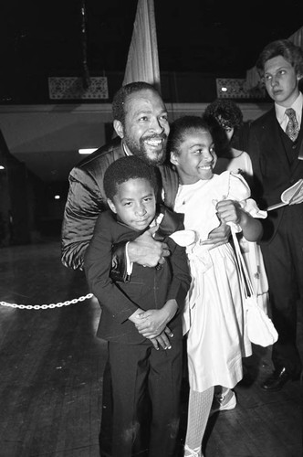 Marvin Gaye hugging his children at the 25th Annual Grammy Awards, Los Angeles, 1983