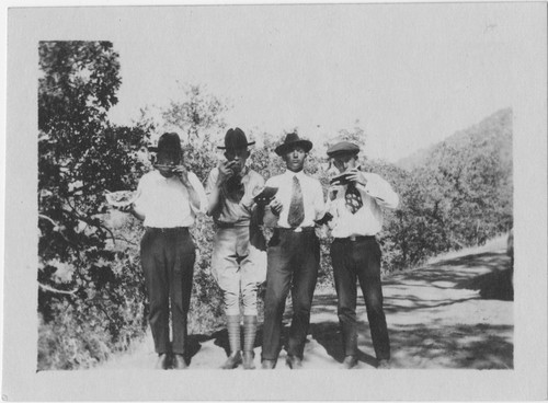 Eating watermelon, Henry Dart Greene, far right