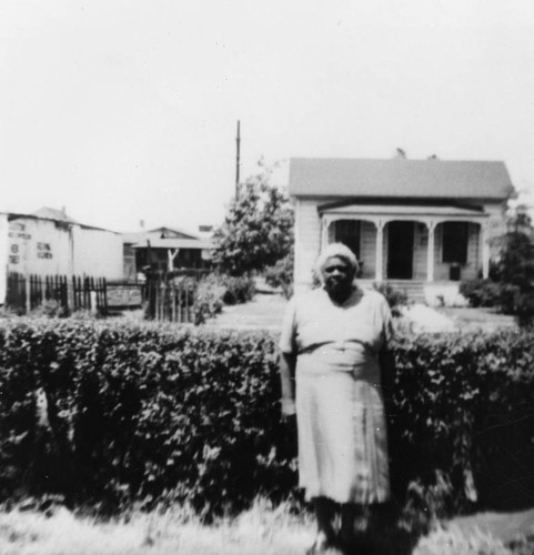Woman outside a home in Los Angeles