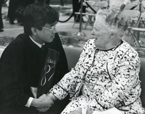 Hung Le speaks to Helen Pepperdine at the Founder's Day program in 1988
