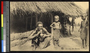 Baluba man smoking a pipe, Congo, ca.1920-1940