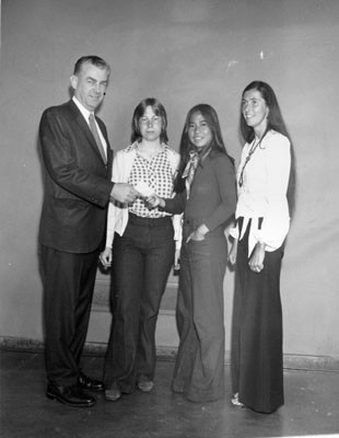 [Principal James Kearney congratulating winners of a public speaking competition at Lowell High School]