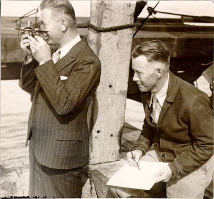 [Engineer A. J. Stocks and assistant engineer William M. Kirby surveying the site of the San Francisco-Oakland Bay Bridge]