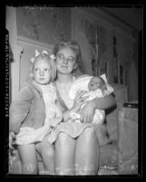 Mrs. William Martin with daughter Rinda Lee Martin and holding baby she bought from black market sources in Los Angeles, Calif., 1948
