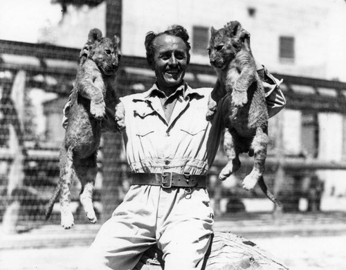 Charles Gay with lion cubs