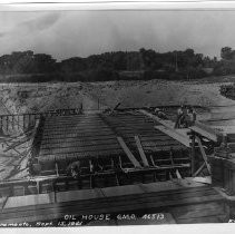 Exterior view of Southern Pacific Company's railyards construction site progress on General Store No. 1 for G.M.O. 46513 in 1921. This view shows progress on the new Oil House