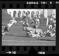 UCLA quarterback John Sciarra in mid-field play during UCLA vs Cal game at the Los Angeles Coliseum, 1975