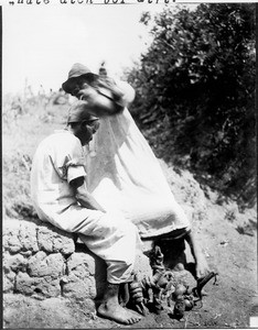 Sorcerer treating a sick man, Tanzania, ca.1913-1938