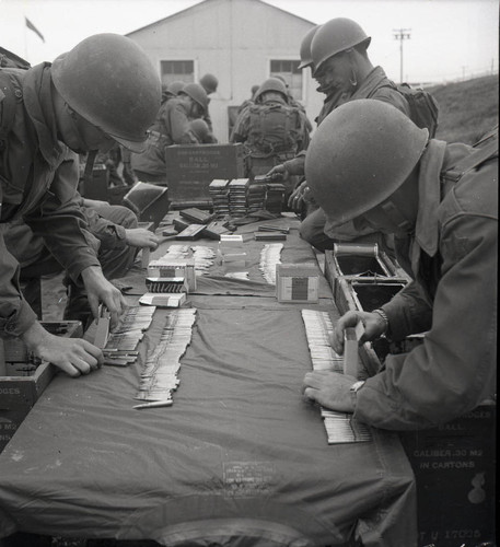 Trainees sorting through .30 caliber ammunition at Fort Ord