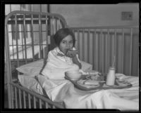 Little girl, Mary Louise Varela, has Thanksgiving dinner at General Hospital, Los Angeles, 1935