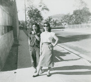 Ernestina Martinez standing in front of the Hammel Street Elementary School yard, East Los Angeles, California