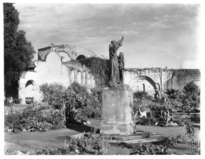 Statue of Father Junipero Serra as monument at Mission San Juan Capistrano, 1929