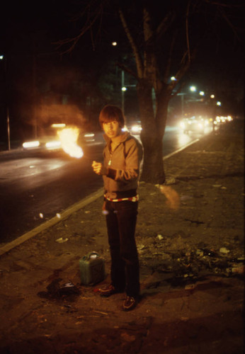 Boy prepares to breathe fire, Mexico City, 1982