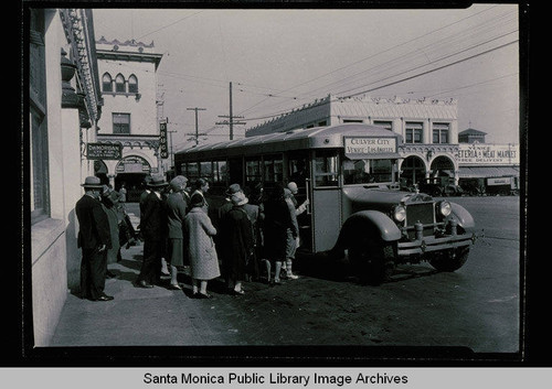 Venice passengers entering the bus of a new bus service between Culver City, Venice and Los Angeles, July 17, 1928