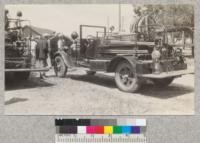 The small Ford fire truck with 225 gallon tank and light auxiliary pumper. Escalon demonstration 1930