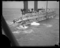 Angled side view of sinking steamship S. S. Harvard on Point Arguello, Calif., 1931
