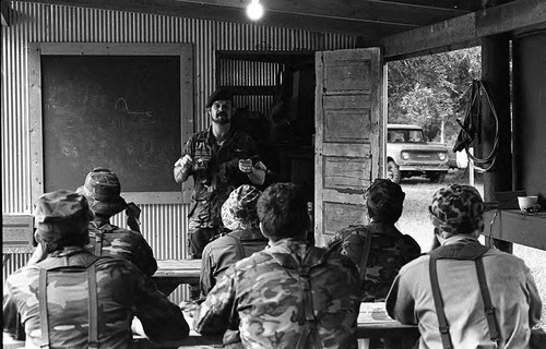 Camp instructor in a classroom, Liberal, 1982