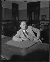 Business man Francis Verhaeren sits at the plaintiff table during a slander trial, Los Angeles, 1931